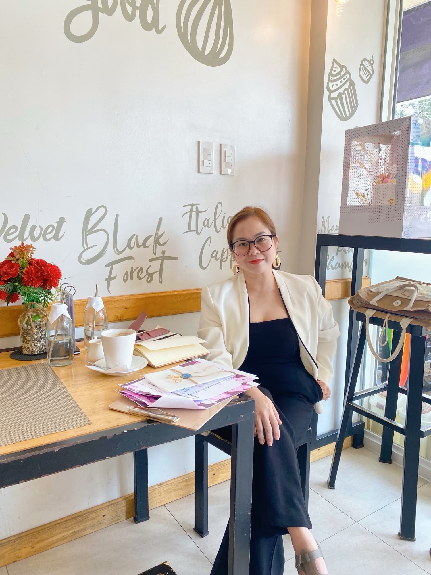 A couple working through wedding plans together over coffee
