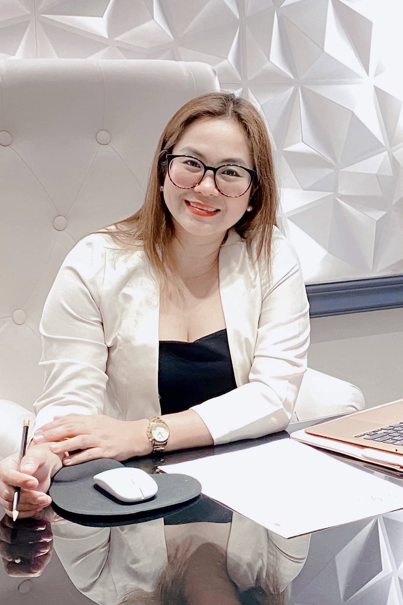 Sharon Joy Rosales-Donguines at her desk in the Ever After office